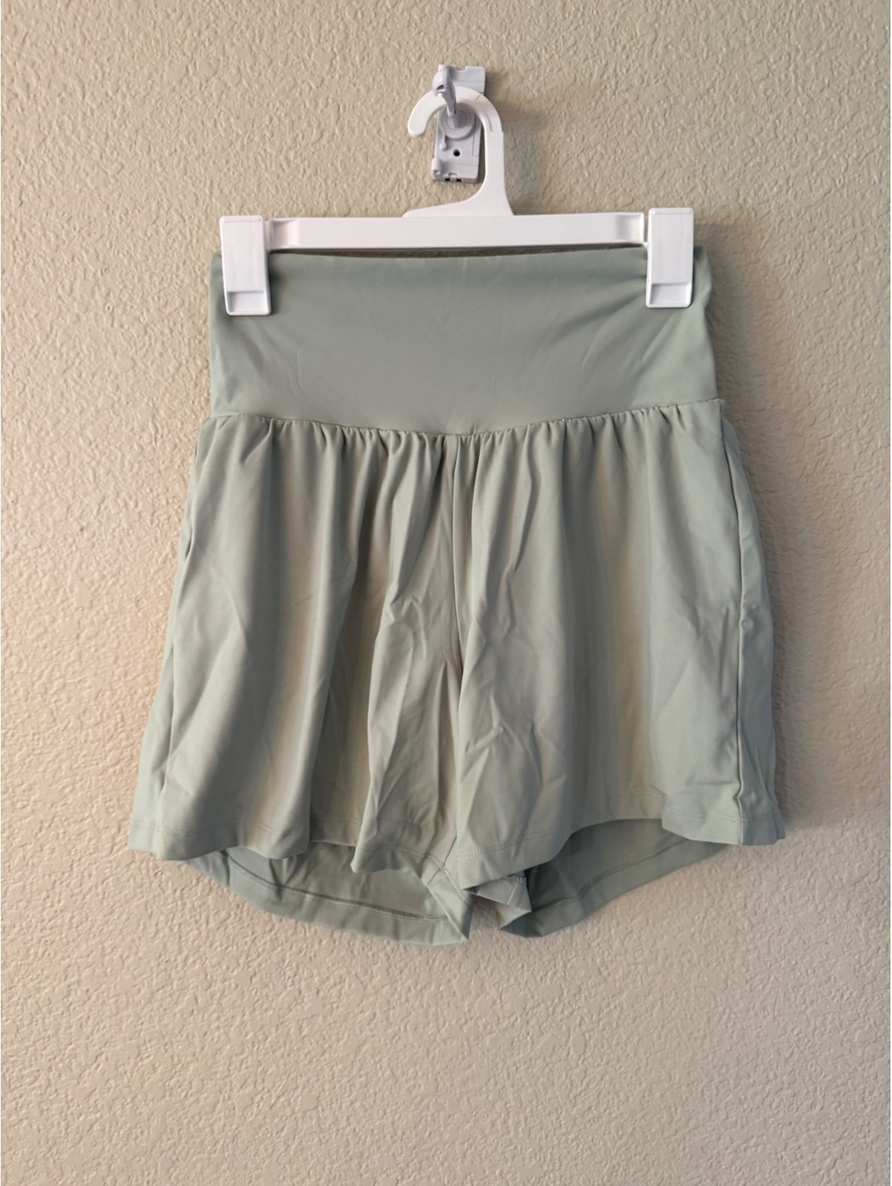 Halara Medium Long High Waisted Double Lined Sage Green Shorts. pockets